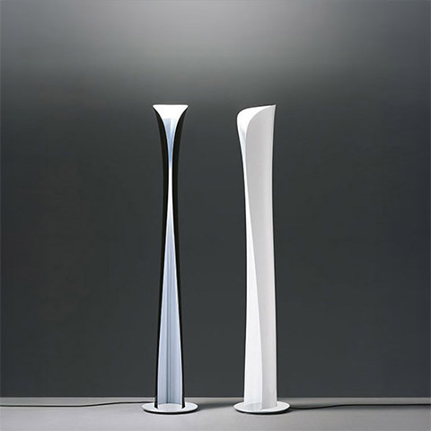 Artemide Cadmo floor lamps: two tall slender sculptural columns in silver and white, flared at top and base, emitting upward light
