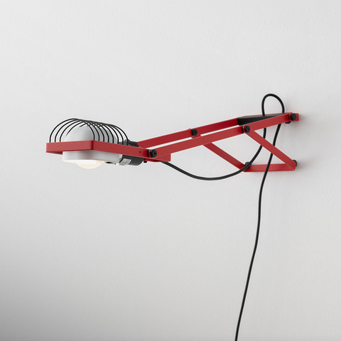 Artemide Sintesi wall lamp in red with articulated arm, wire guard, white diffuser, and black power cord