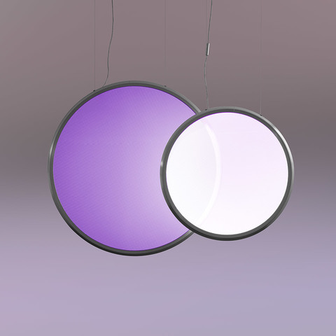 Two overlapping circular Discovery INTEGRALIS pendant lamps: larger purple-lit disc on left, smaller white-lit disc on right, dark frames