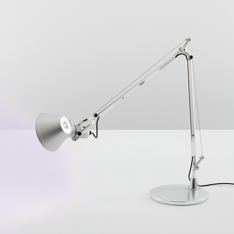 Artemide Tolomeo Tavolo INTEGRALIS desk lamp in white, featuring adjustable articulated arm, conical shade, and round base