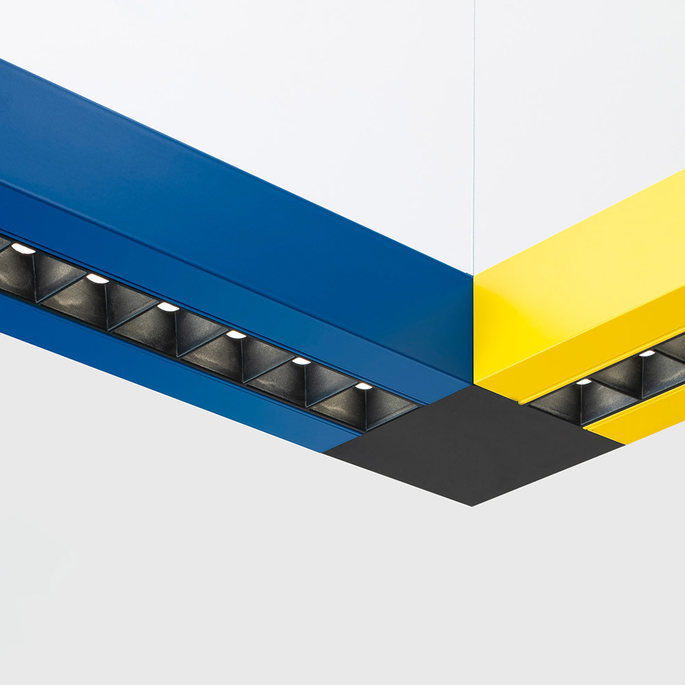 Katà Métron modular suspension system in blue and yellow with Refractive technology.