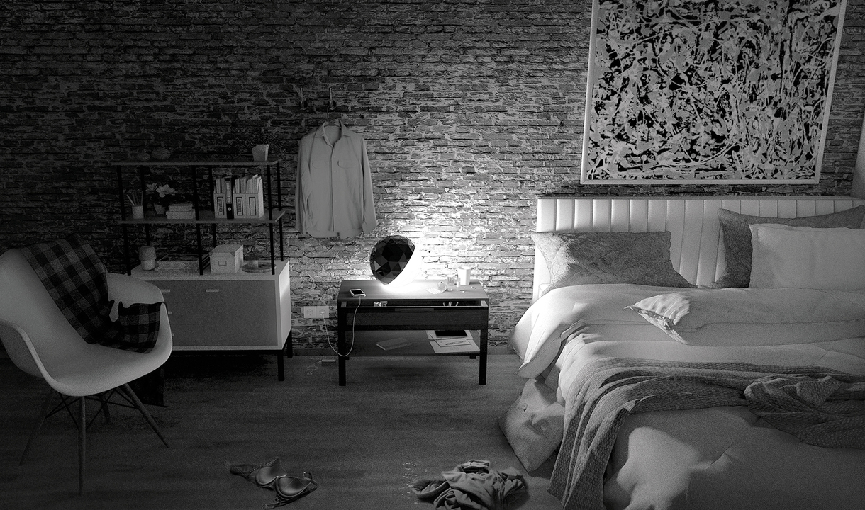 Camera da letto con muro di mattoni a vista con lampada da tavolo Artemide su tavolino, che illumina lo spazio accanto al letto.