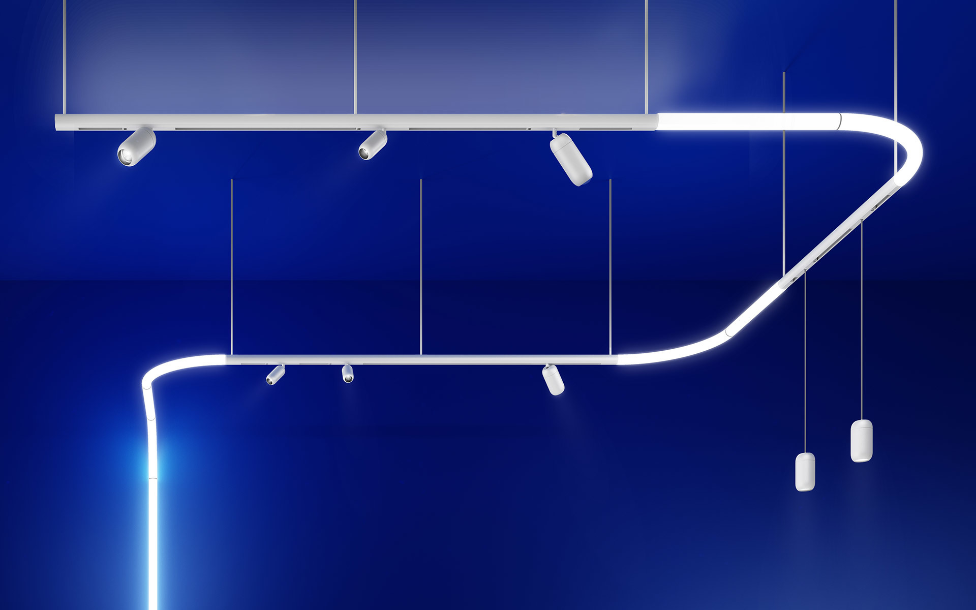 Sistema di illuminazione modulare bianco Artemide: binario LED curvo con faretti integrati e sospensioni cilindriche su sfondo blu intenso