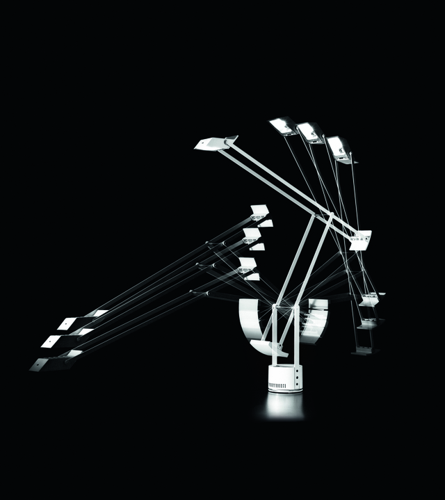 Artemide Quasar table lamp with multiple articulated chrome arms and square LED heads radiating from a central base, shown in motion
