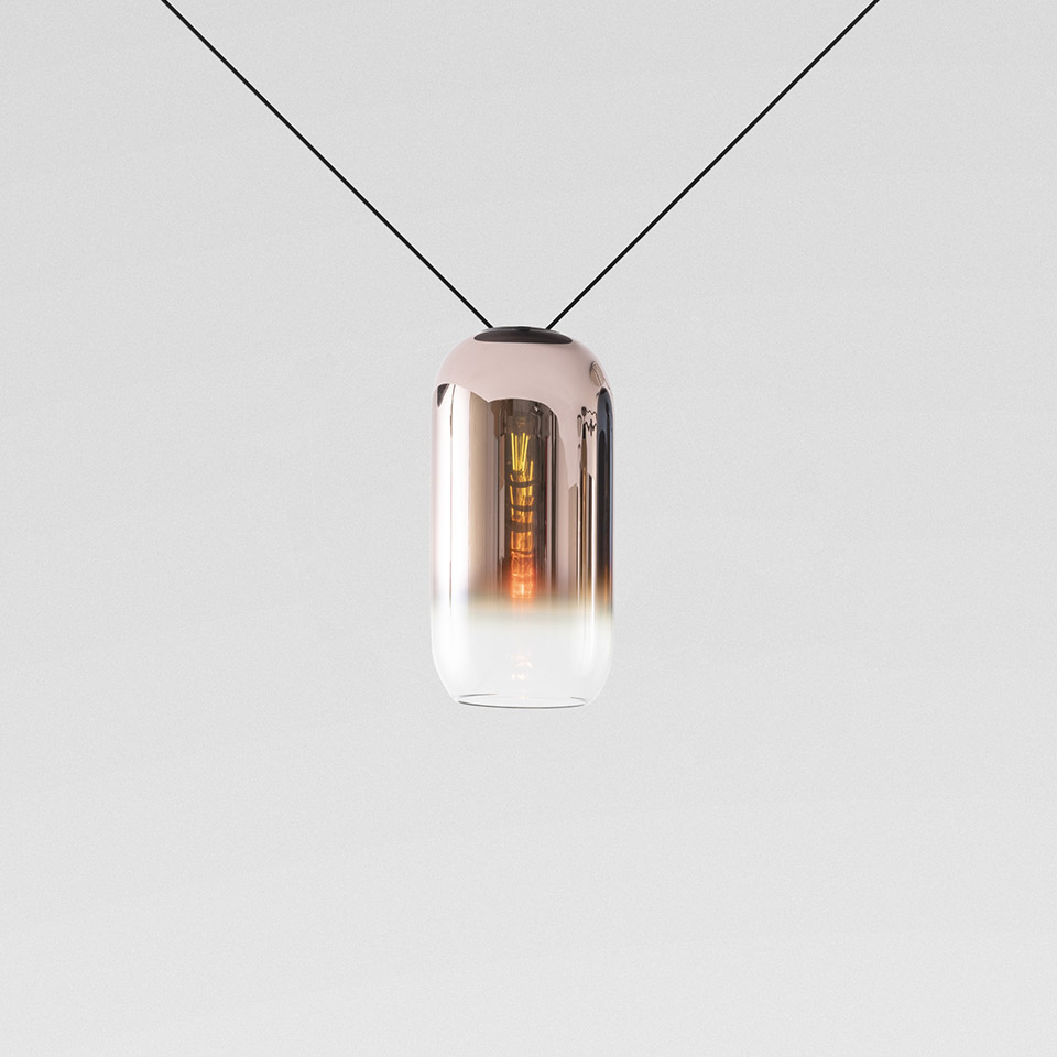 Artemide Funivia pendant lamp: capsule-shaped glass shade with copper-to-clear gradient, suspended by two black cables