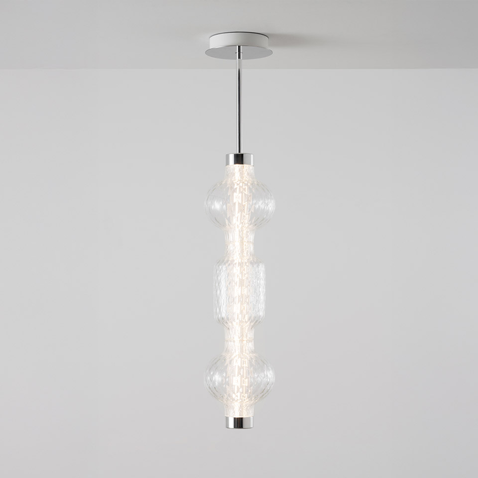 Artemide Alambicco pendant lamp: three stacked clear textured glass globes on a chrome central stem, suspended from ceiling