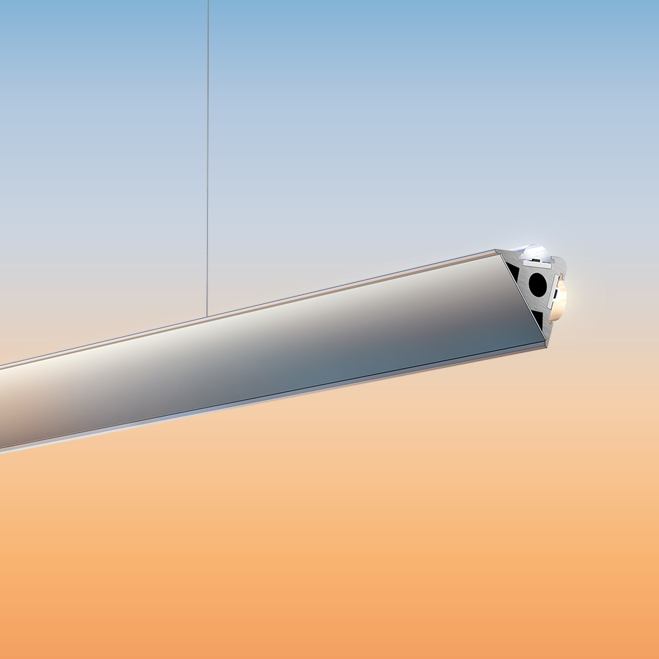 Artemide Dusk pendant lamp: sleek elongated aluminum profile suspended by cable, with integrated LED light source at end cap