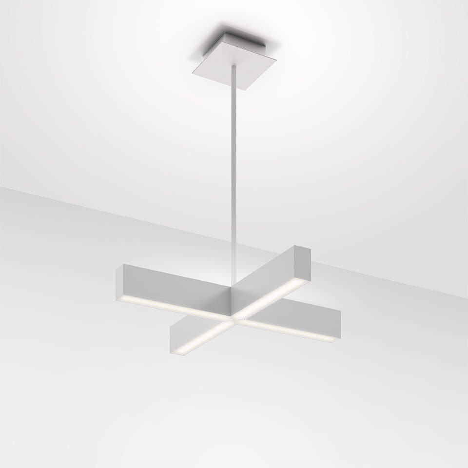 Artemide Tetras pendant lamp: cross-shaped white aluminum fixture with two intersecting rectangular LED bars, suspended from ceiling