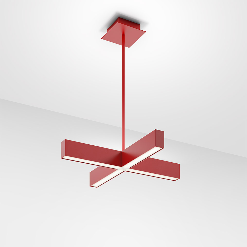 Artemide Tetras pendant lamp in red, featuring a cross-shaped LED light bar suspended from the ceiling by a slim rod