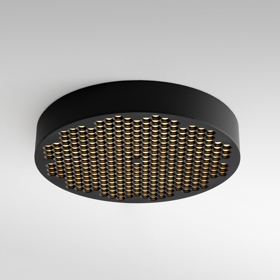 Plafoniera Artemide Helgoland: corpo rotondo nero con griglia di piccoli LED dorati che creano un pattern luminoso caldo e diffuso