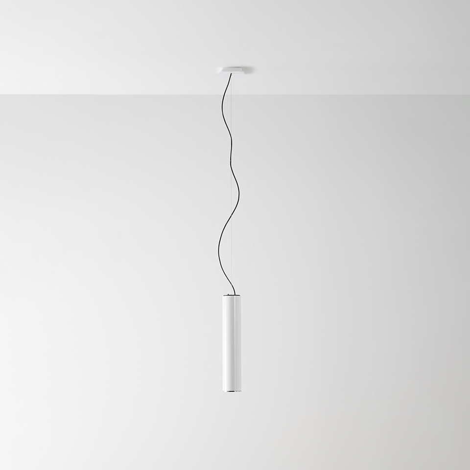 Artemide Ilio pendant lamp: slim white cylindrical body suspended from ceiling by a black wavy cable on white canopy