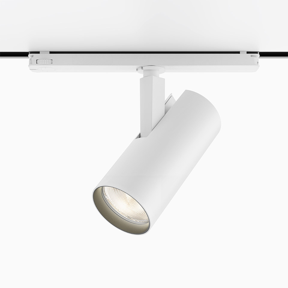 Faretto bianco Artemide Vector Track 230V montato su binario, corpo cilindrico con sorgente LED, orientamento regolabile