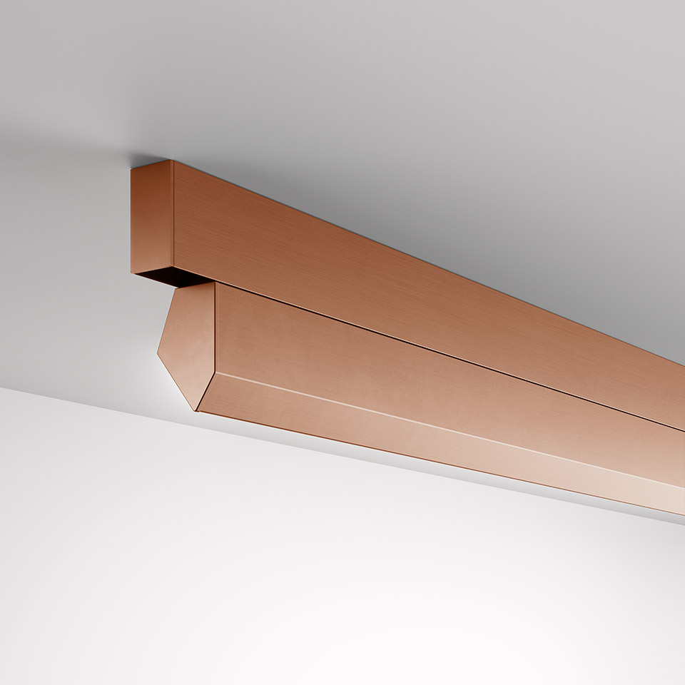 Artemide A.24 Wall Washer: sleek linear ceiling-mounted fixture in brushed copper finish with angled diffuser for wall washing