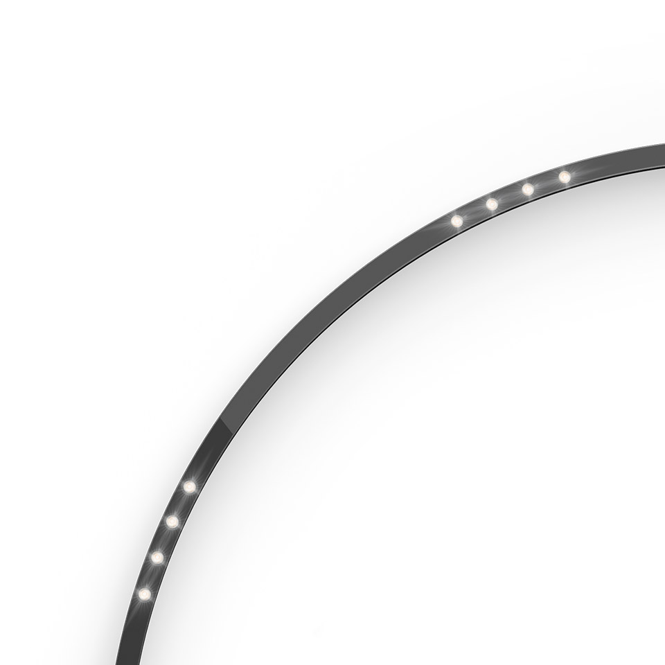 Artemide A.24 curved LED strip light in black, slim arc profile with evenly spaced warm white light points