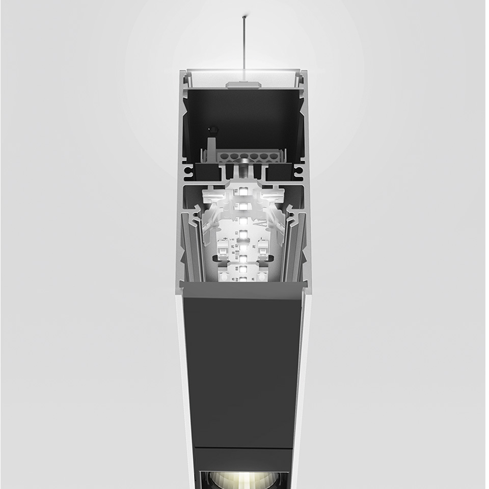 Sezione trasversale della lampada a sospensione/soffitto Artemide A.39 che mostra il modulo LED interno, il sistema ottico e il profilo estruso in alluminio nero e argento