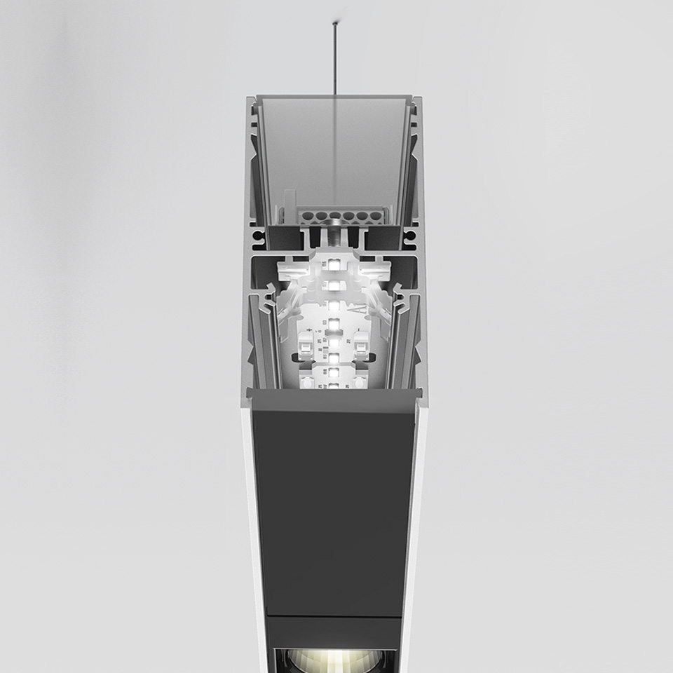 Sezione trasversale della sospensione Artemide A.39 che mostra i componenti LED interni, il profilo in alluminio e l'emissione luminosa verso il basso in finitura scura - 2