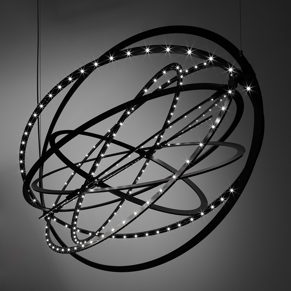 Artemide Copernico suspension lamp: multiple black metal rings arranged in a spherical orbit, studded with bright LED point lights