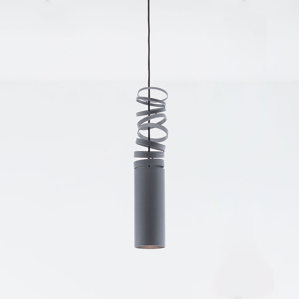 Artemide Decomposé Light pendant lamp: grey cylindrical body with decorative metal spiral coil wrapping the upper section, suspended by black cord