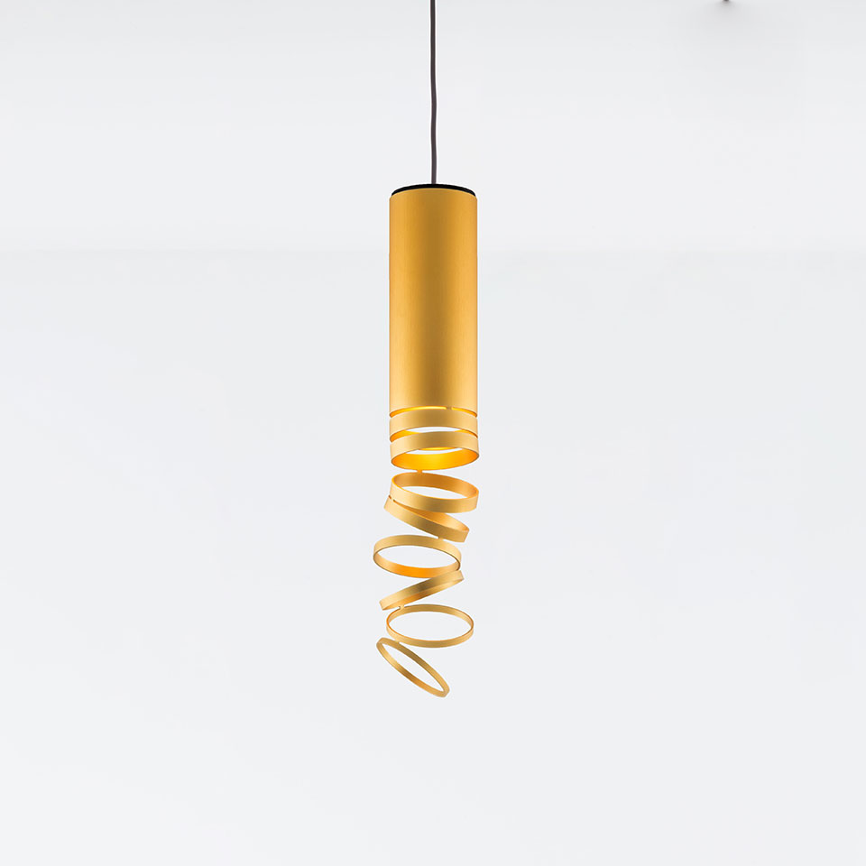 Artemide Decomposé Light pendant lamp in gold, featuring a cylindrical body with a spiraling ribbon shade on a black cord