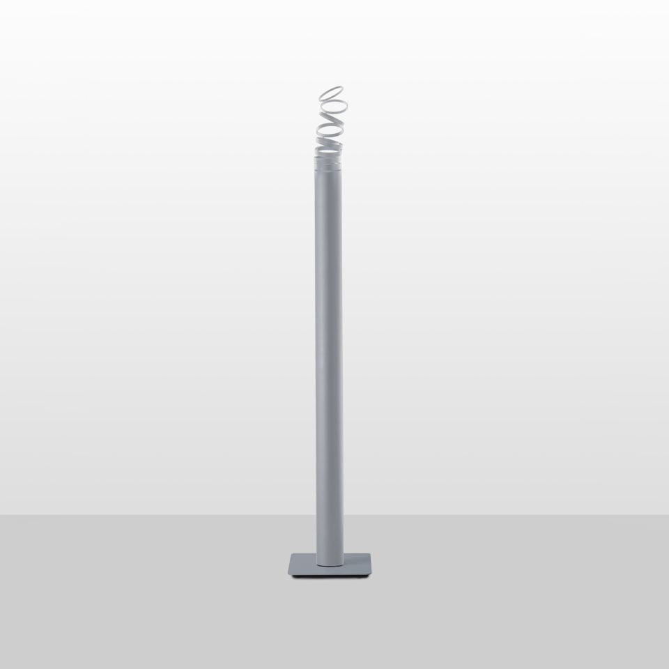 Lampada da terra Artemide Decomposé Light Terra: alto fusto cilindrico grigio su base quadrata, con elemento luminoso LED a spirale bianca in cima