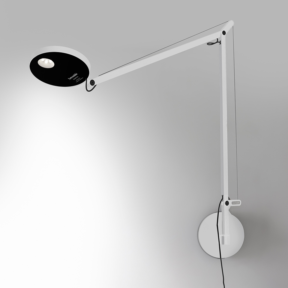 Artemide Demetra Parete wall lamp in white with articulated arm, oval black LED head, and circular wall mount