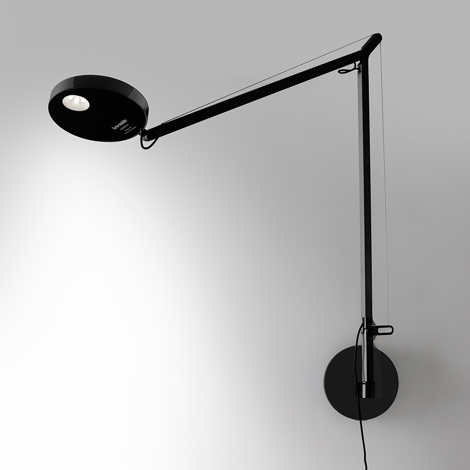 Artemide Demetra Parete wall lamp in black, featuring an adjustable articulated arm and circular LED head mounted on a wall bracket