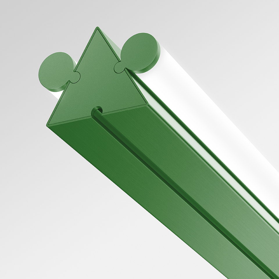 Artemide Dreispitz linear LED lamp detail: green triangular-section profile with circular connectors and white light diffuser strip