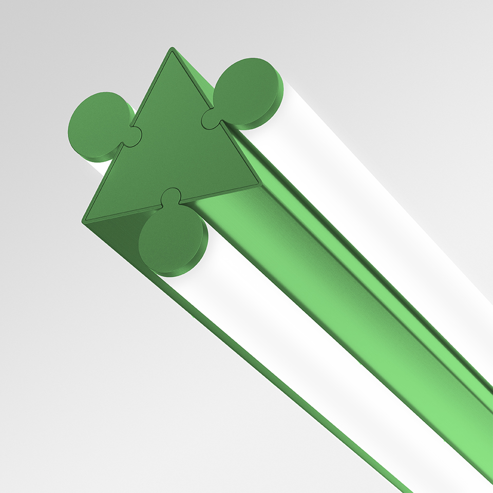 Dreispitz linear LED luminaire detail: green triangular profile with modular connector end cap, showing interlocking joint system
