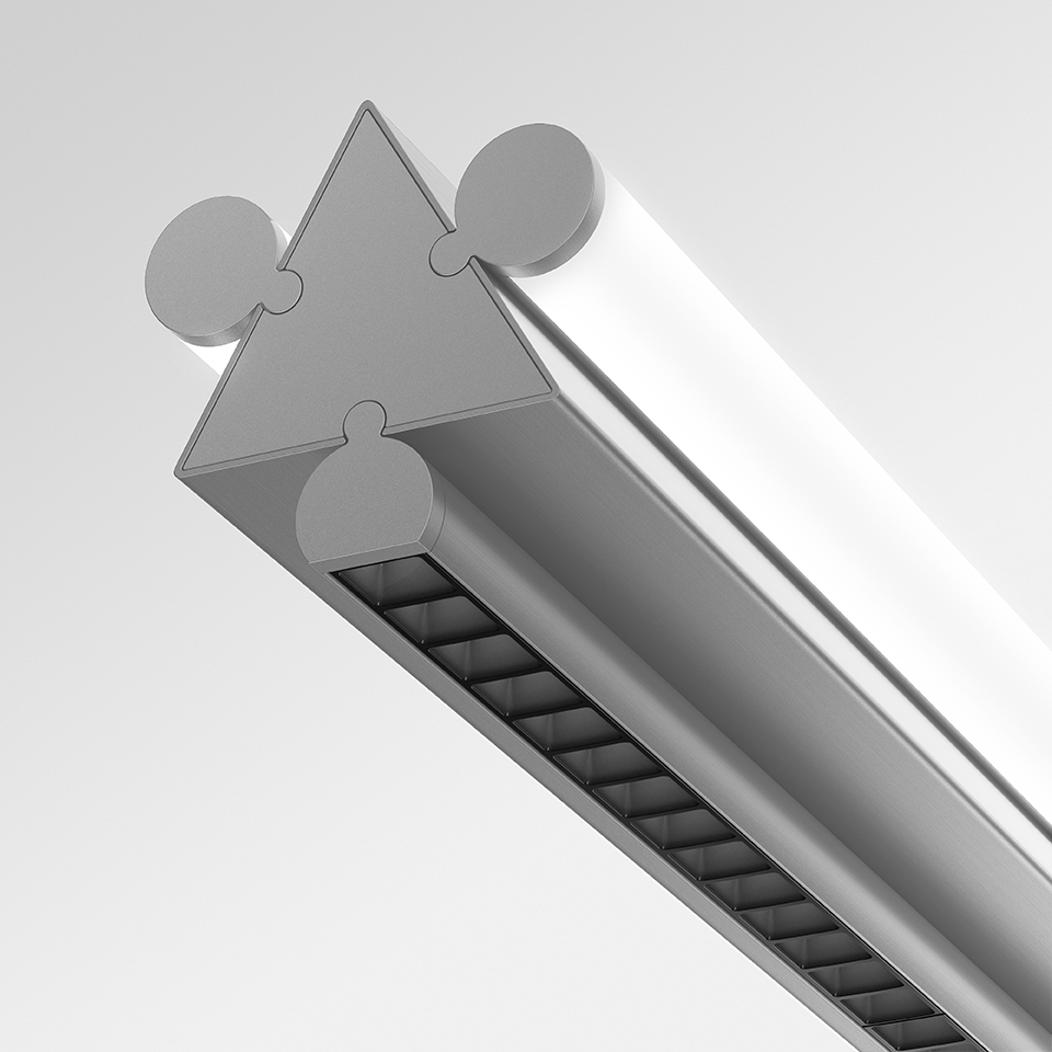 Close-up of Artemide Dreispitz linear LED fixture cross-section, showing triangular aluminum profile with snap-fit connectors and louvered light output