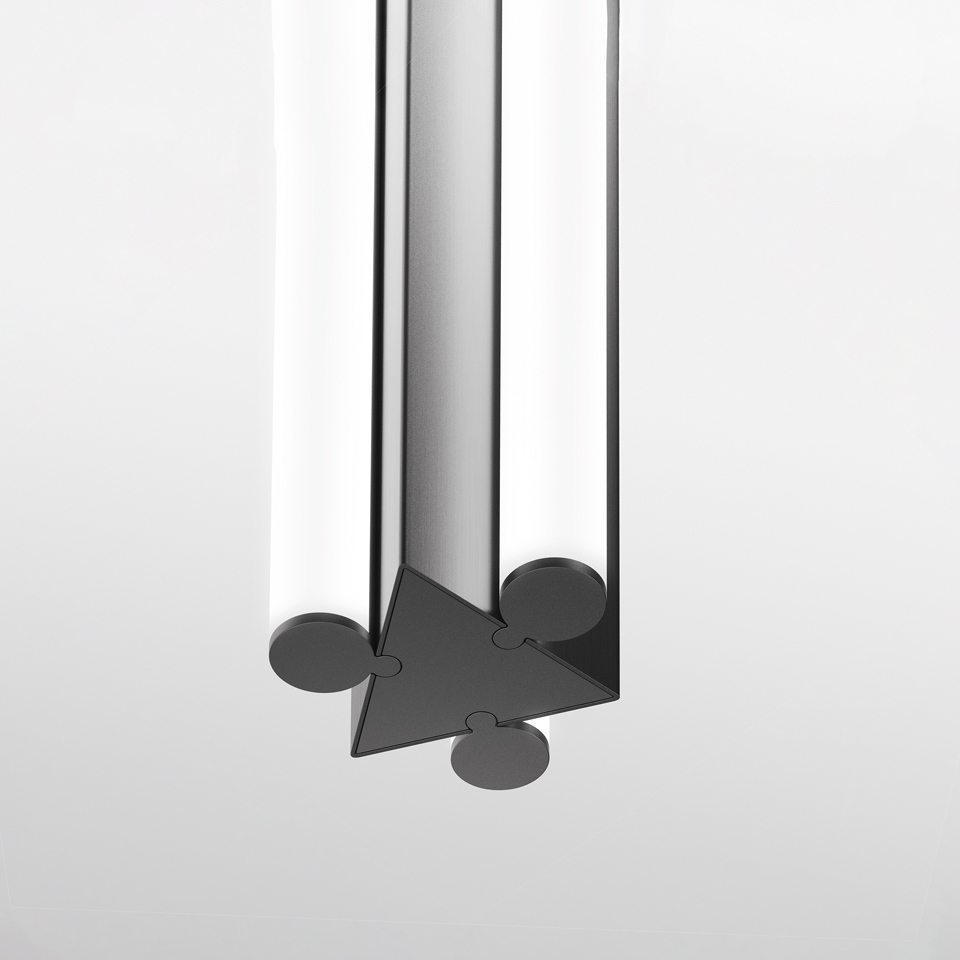 Dreispitz pendant lamp detail: dark triangular metal joint connecting three cylindrical frosted glass tubes with circular end caps