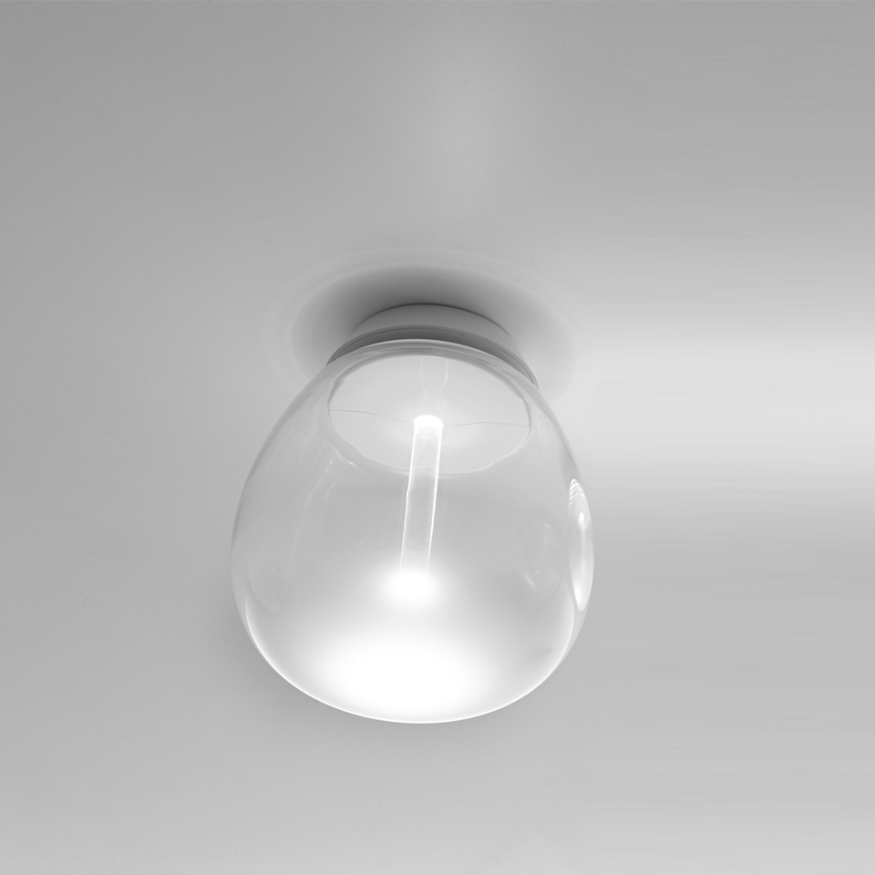 Artemide Empatia wall/ceiling lamp: clear glass drop-shaped diffuser with central LED element, mounted flush on white ceiling