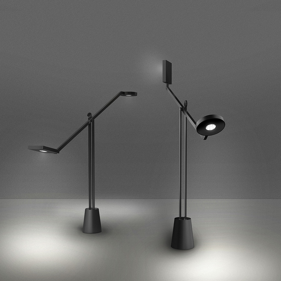 Two Artemide Equilibrist black desk lamps with articulated arms and circular shades, shown in different positions on conical bases