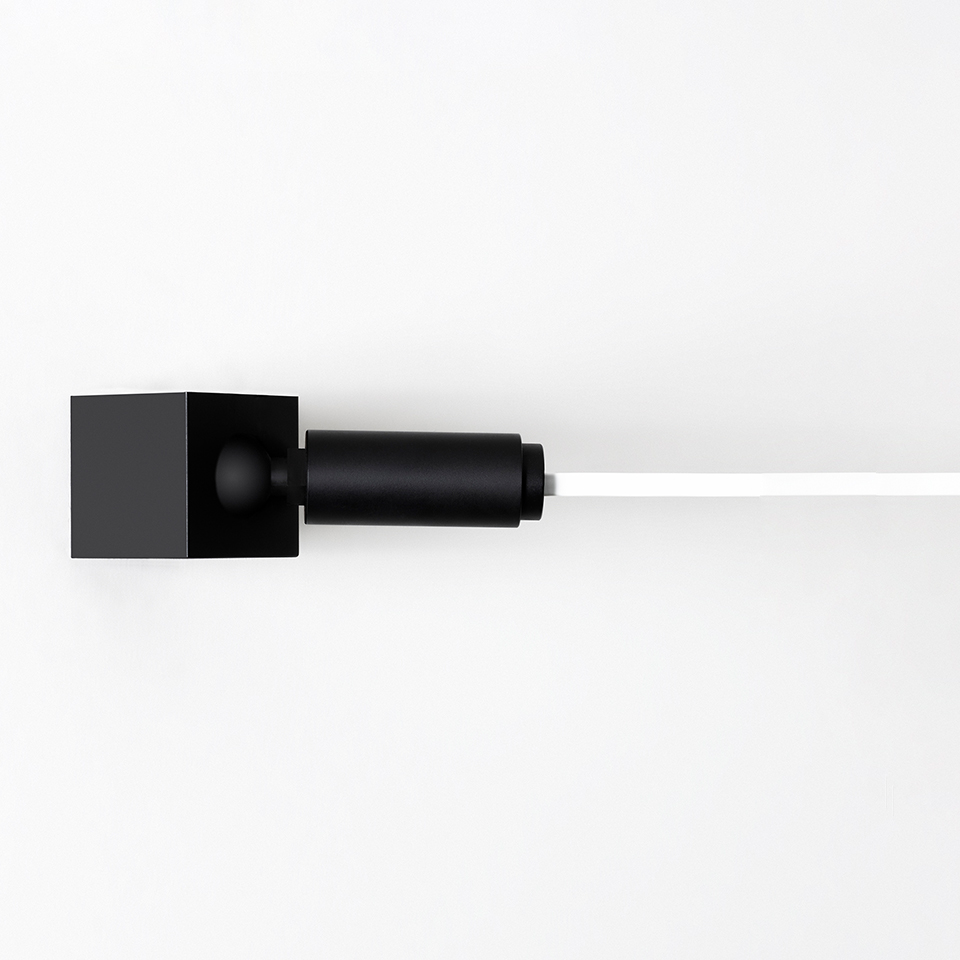 Artemide Funivia wall lamp: black cubic wall mount with cylindrical joint extending a slim white horizontal light bar