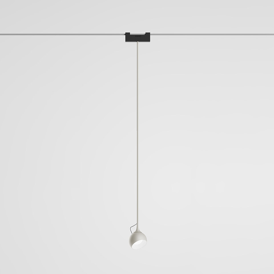 Artemide Funivia pendant lamp: white spherical head on a thin cable suspended from a black track-mounted ceiling connector