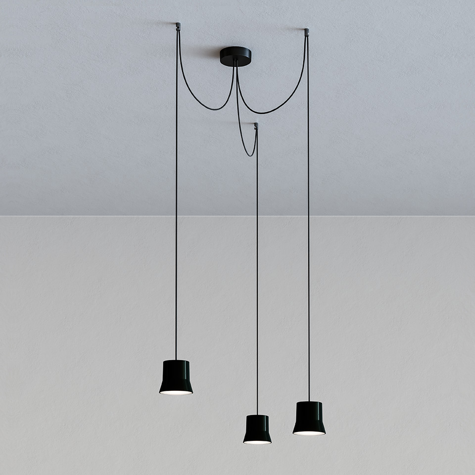 Artemide Giò Light Cluster: three black conical pendant lamps at varying heights on black cords from a single ceiling canopy