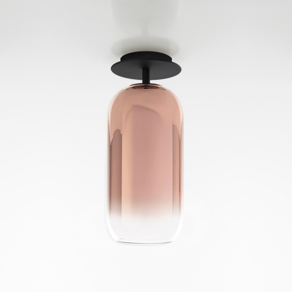 Artemide Gople ceiling lamp: capsule-shaped blown glass shade with bronze-to-clear gradient, mounted on black metal ceiling plate