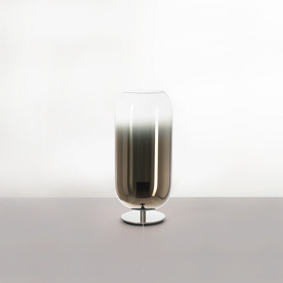 Artemide Gople table lamp: tall cylindrical blown glass diffuser with smoky grey gradient, on a slim chrome base