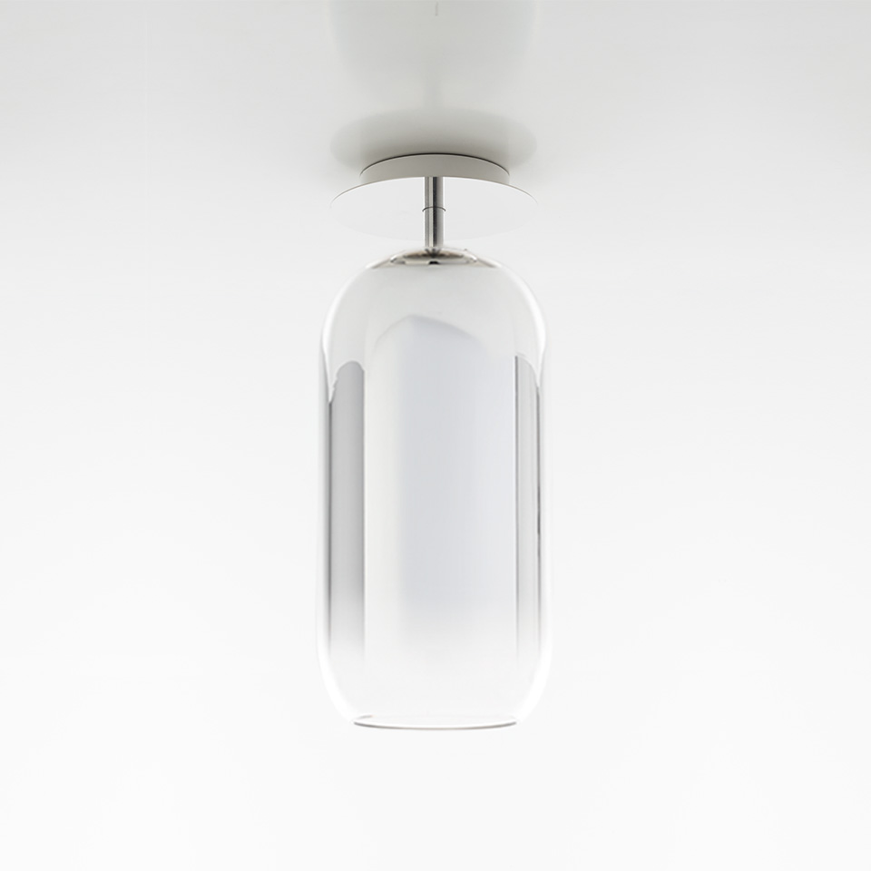 Artemide Gople ceiling lamp: elongated capsule-shaped clear glass diffuser with inner white opal shade, chrome stem mount
