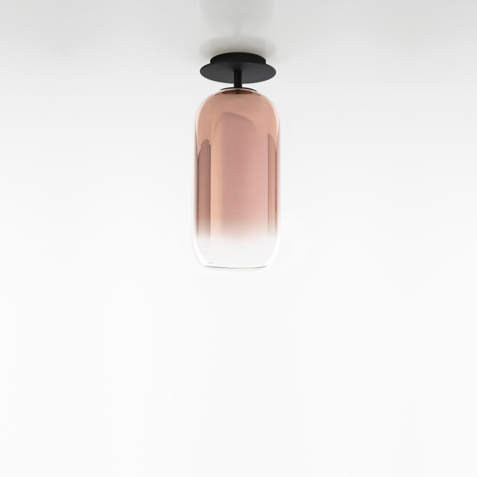 Artemide Gople ceiling lamp with elongated capsule-shaped rose gradient blown glass diffuser and black metal ceiling mount