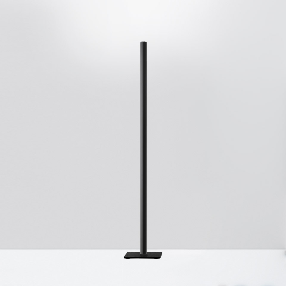 Artemide Ilio Mini floor lamp: slim black cylindrical stem with integrated LED, mounted on a flat rectangular black base