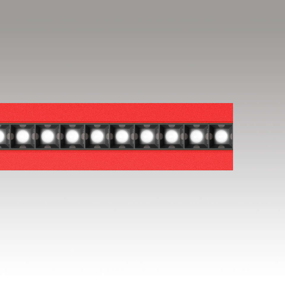 Barra luminosa lineare LED Katà Métron in rosso, con una fila di moduli LED quadrati a vista in alloggiamento nero