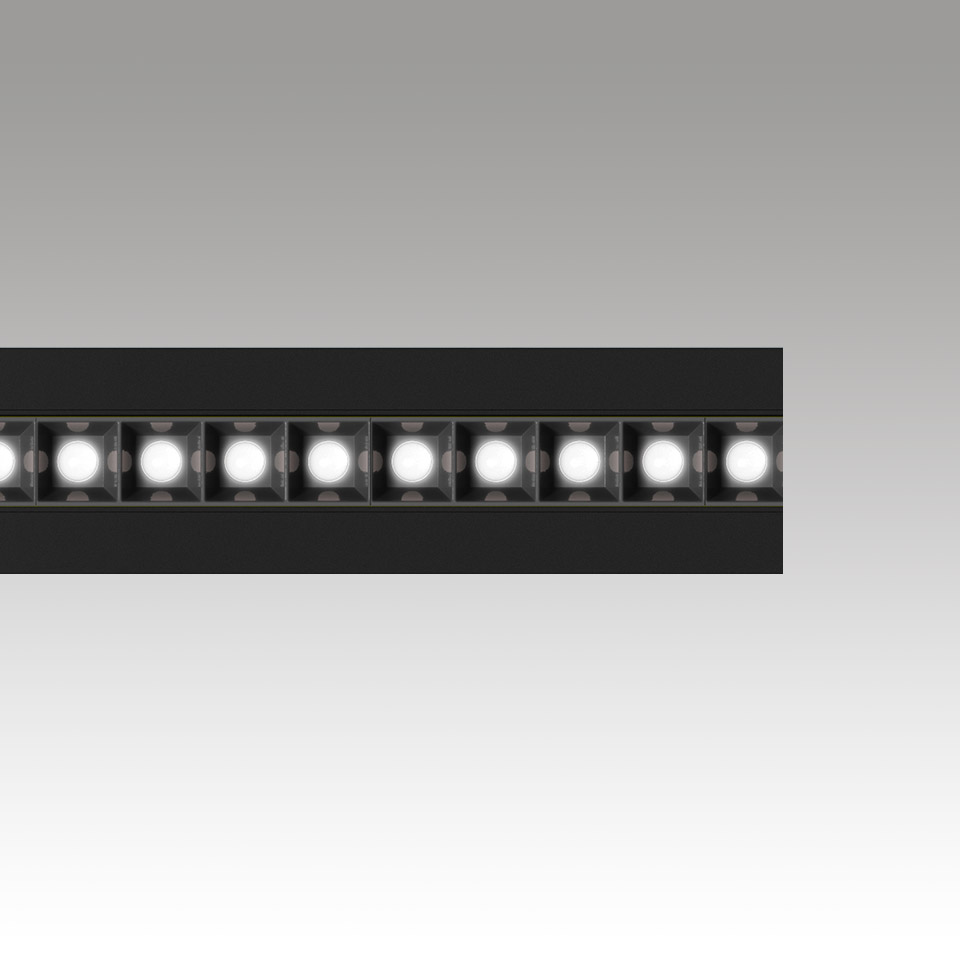 Apparecchio LED lineare Artemide Katà Métron in nero, con una fila di moduli LED quadrati singoli che emettono luce bianca intensa