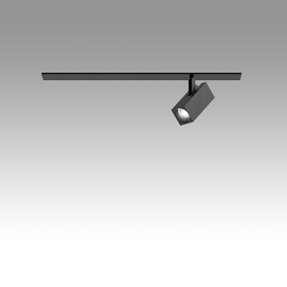 Sistema di illuminazione su binario Artemide Katà Métron: binario nero con testa spotlight LED quadrata regolabile, inclinata per illuminazione direzionale