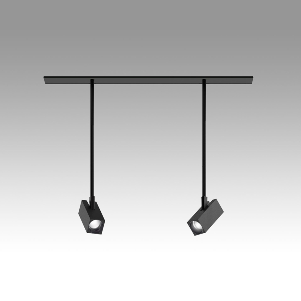Artemide Katà Métron: due faretti a sospensione neri con testine cubiche su aste sottili, appesi a una barra a soffitto