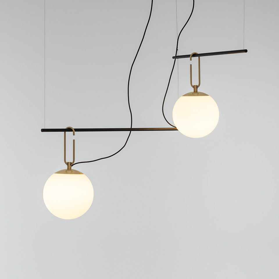 Artemide NH suspension lamp: two opal glass globe shades on brass U-hooks along an asymmetric black horizontal bar, black cords