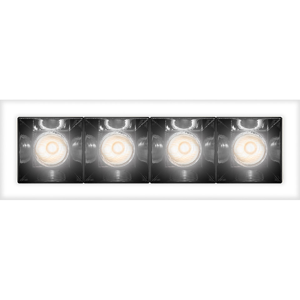 Artemide Sharp recessed ceiling light with four aligned LED modules in a white rectangular frame with dark reflectors