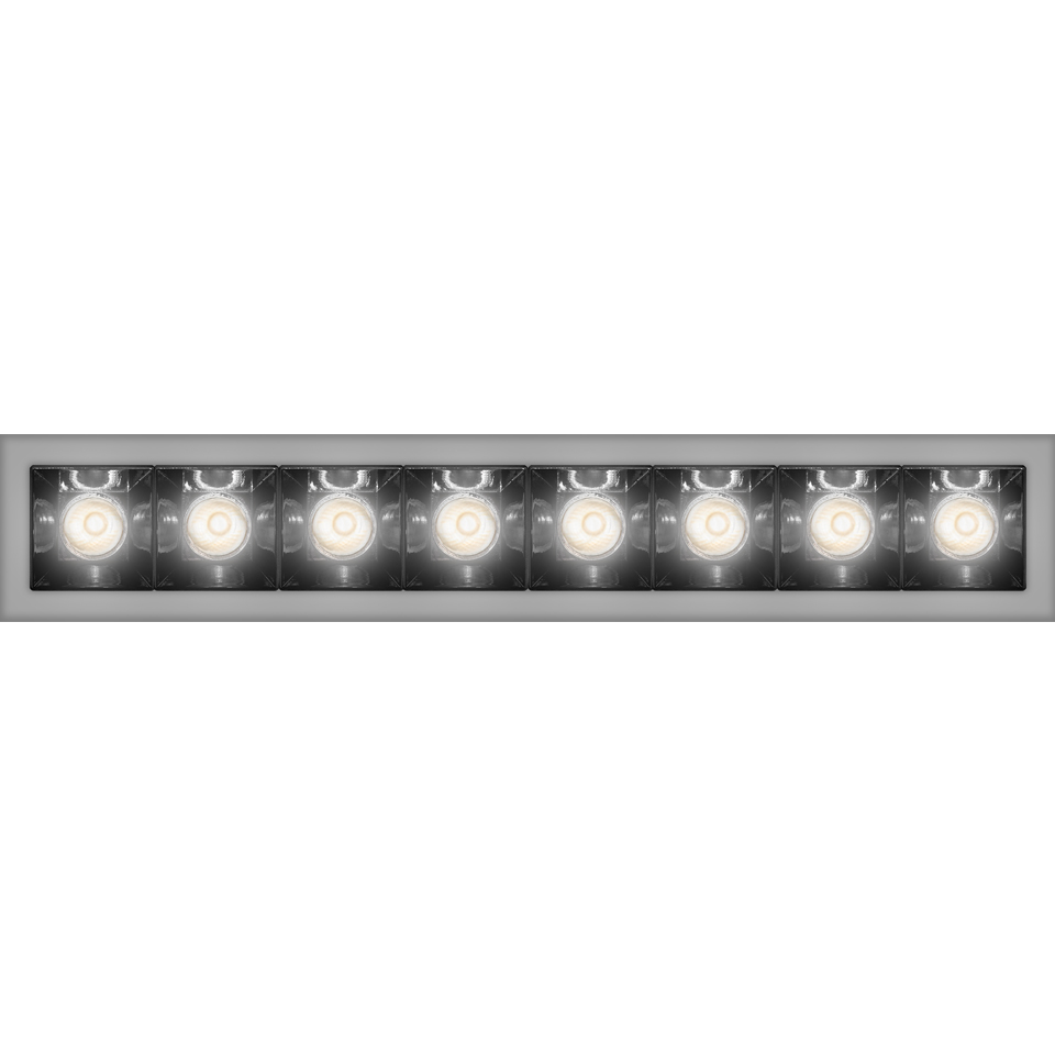 Artemide Sharp recessed linear LED fixture with 8 adjustable spotlights in a silver frame with black interior