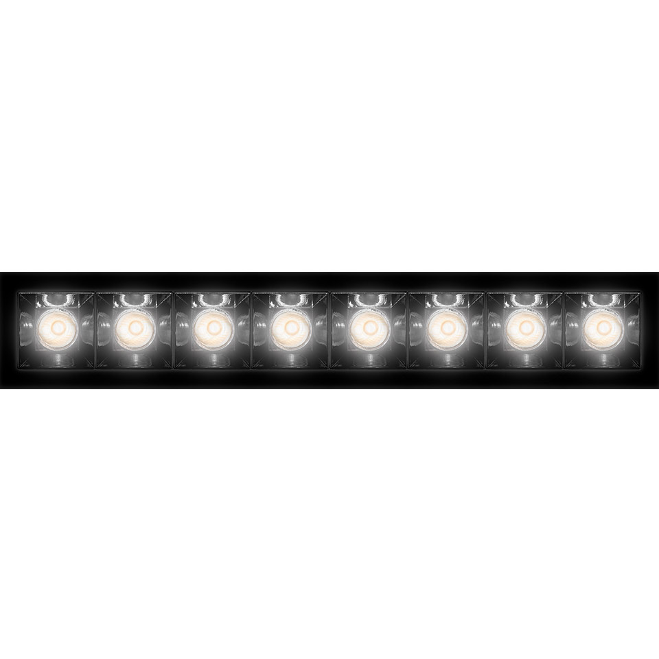 Artemide Sharp recessed LED bar light with eight aligned spotlights in black rectangular frame, emitting warm white light