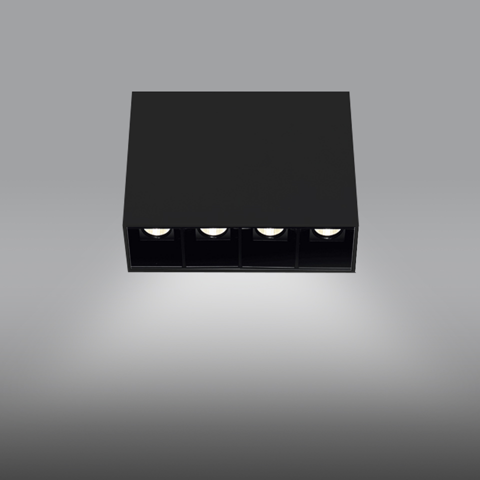 Artemide Sharp SMD ceiling light, black square housing with four recessed LED spots casting focused downward beam