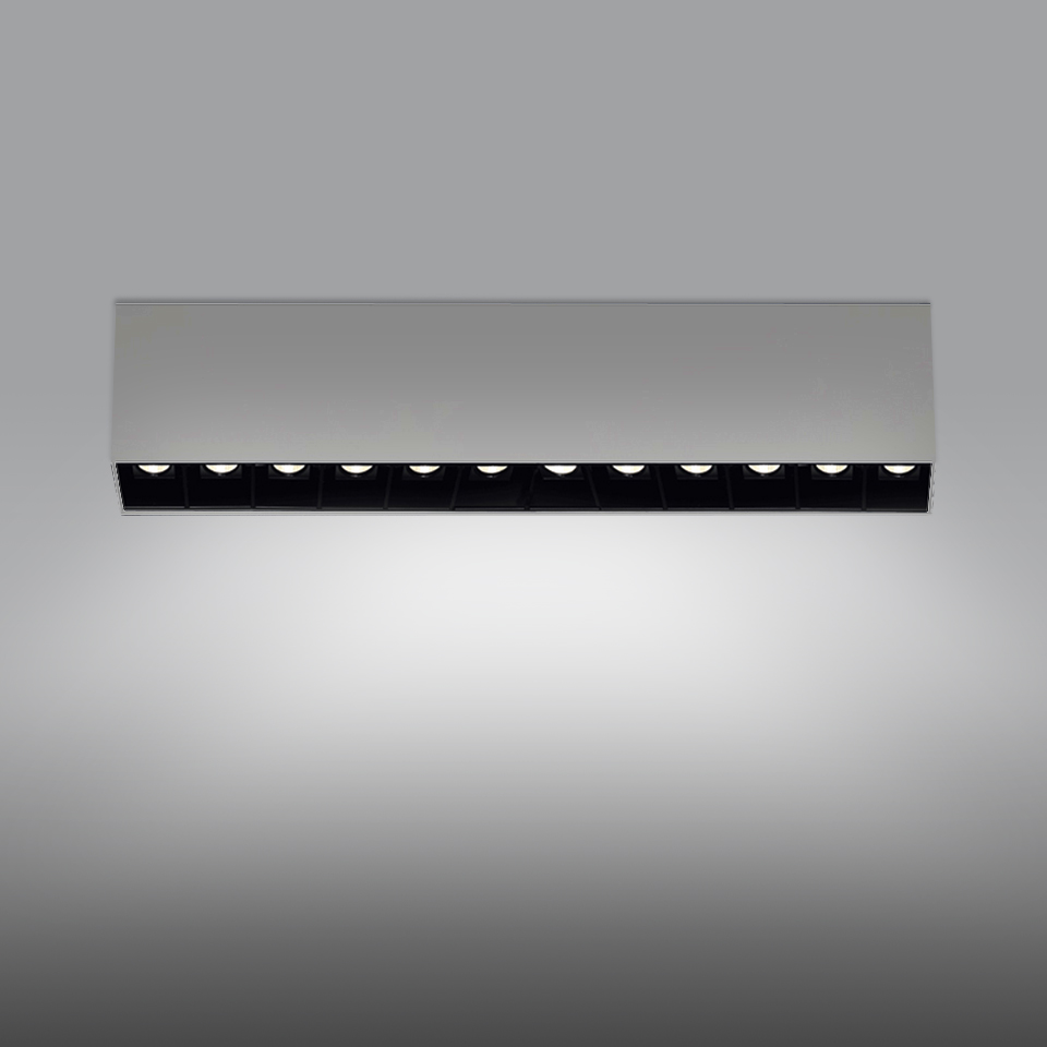 Artemide Sharp SMD recessed linear LED fixture, white aluminum body with black cell grid housing 10 directional LED modules